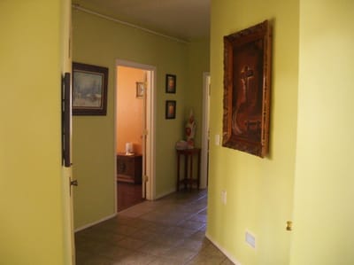 Hallway in a facility with green walls