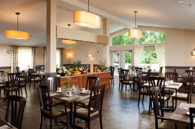Interior of a dining room with tables and chairs