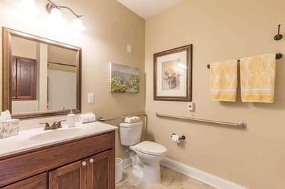 Brightly decorated bathroom with floral artwork