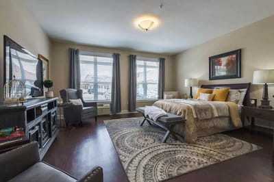 A well-furnished private resident room with natural light