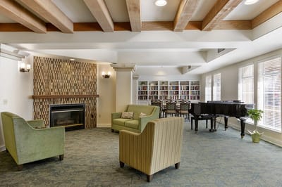 Interior common area with seating and a piano