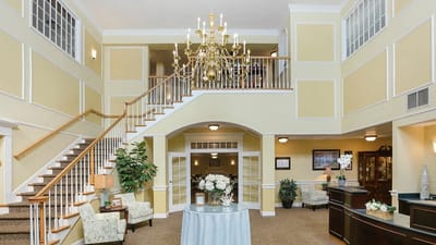 Bright interior lobby with chandelier and seating area