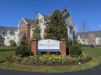 Exterior view of Brookdale Assisted Living facility sign and landscaping