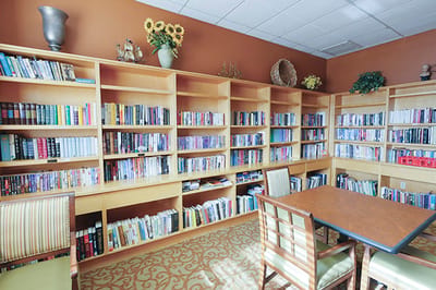 Interior library with bookshelves and tables