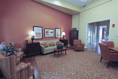 Bright common area with seating and artwork