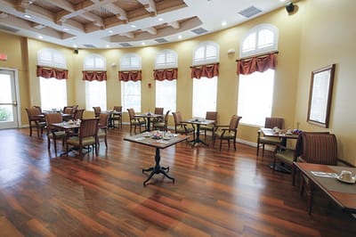 Dining area with empty tables and chairs