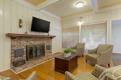Common area with a fireplace and seating