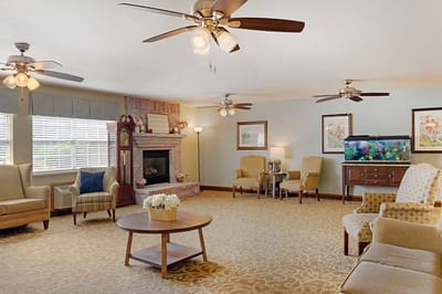 Bright common area with seating and fish tank