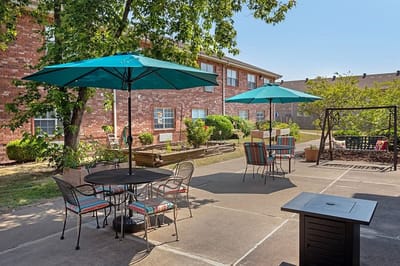 Outdoor seating area with umbrellas and plants