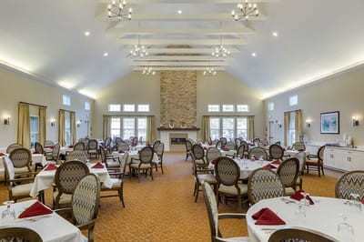 Elegant dining room with round tables set for meals