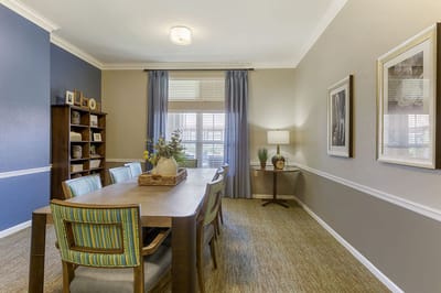 Bright common area with dining table and decor
