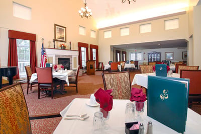 Dining room set for a meal with decorative table settings