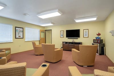 Bright common area with seating and television