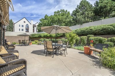 Outdoor seating area with patio and umbrellas