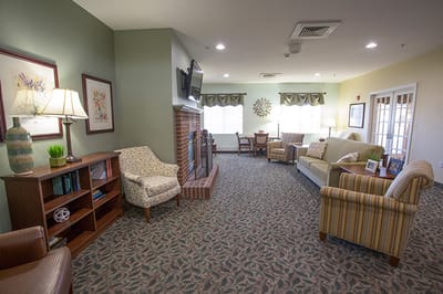 Cozy common area with seating and a fireplace
