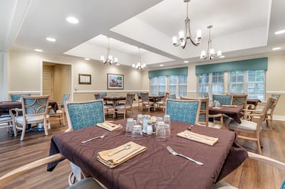 Well-set dining area with tables and chairs