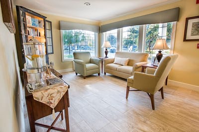 Bright common area with seating and natural light