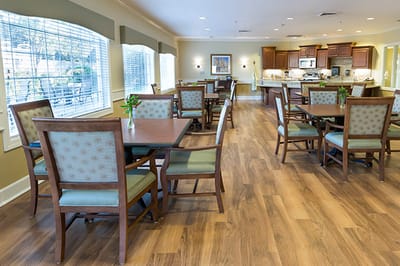 Dining room with tables and chairs in a bright interior