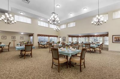 Bright dining room with tables set for meals