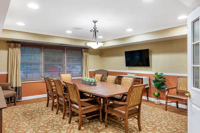 Bright common area with a large meeting table