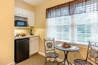 Bright kitchenette area with a small dining table