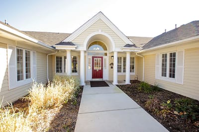 Exterior view of the facility entrance with landscaping