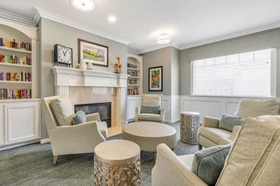 Cozy common area with seating and bookshelves