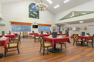 Bright dining room with tables set for meals