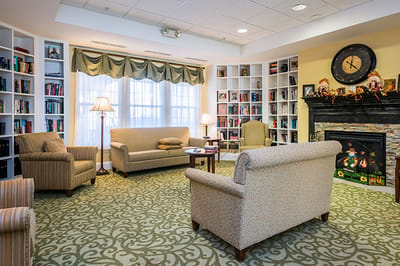 Cozy common area with seating and bookshelves