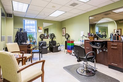 Hair salon interior with styling chairs and equipment