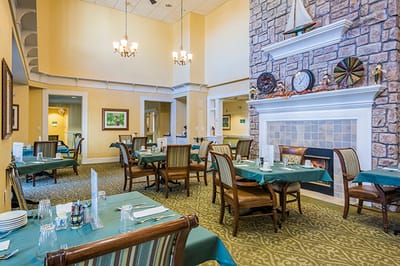 Dining area with tables and chairs in a well-lit room
