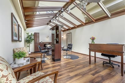 Bright interior space with seating and salon area