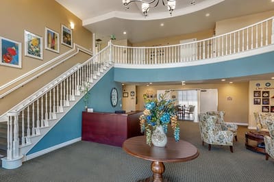 Bright lobby of a senior living facility with seating and decor