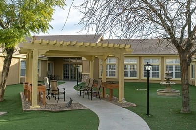 Outdoor area with seating and landscaping near the facility