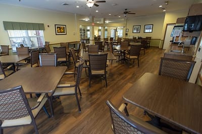 Bright and spacious dining room with tables and chairs