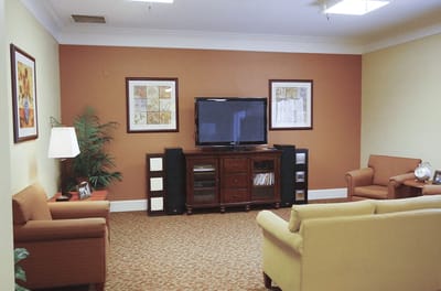 Cozy common area with seating and a TV