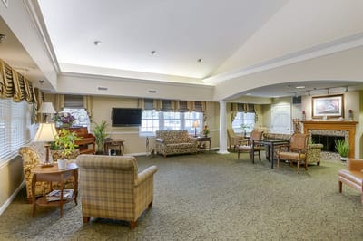 Bright common area with seating and piano