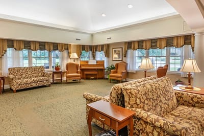 Cozy common area with comfortable seating and piano