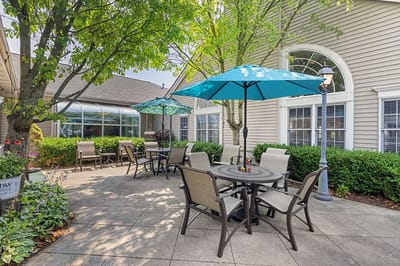 Outdoor seating area with umbrellas in a garden