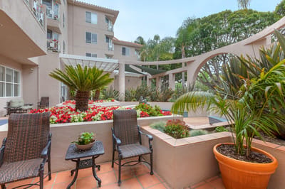 Outdoor garden area with seating and flowers