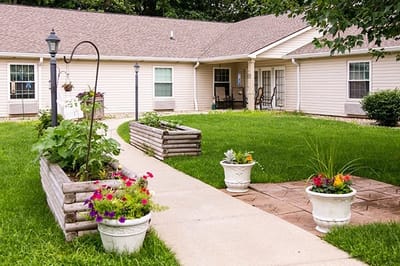 Pathway through a landscaped outdoor space with flowers