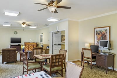 Common area with seating and computers for residents