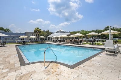 Pool area with umbrellas and seating