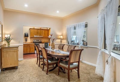 Dining area with a large table and chairs
