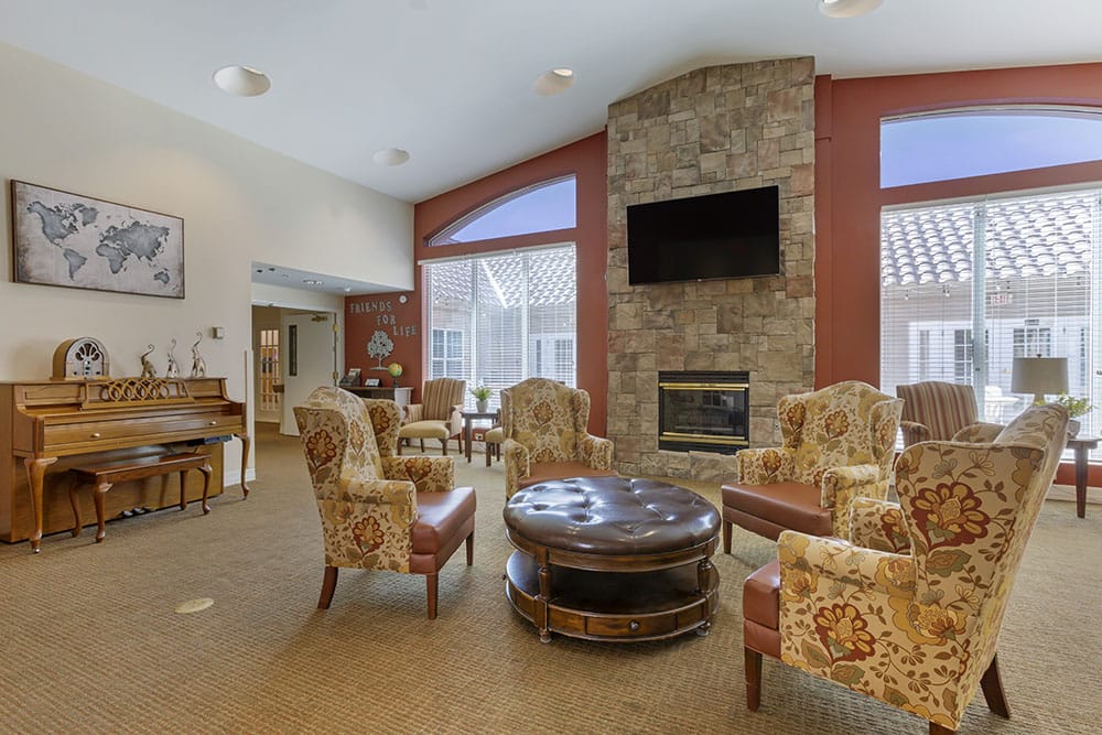 Interior common area with seating and a piano