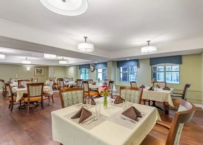 Dining room with tables set for meals