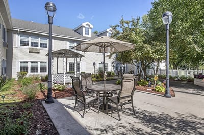Outdoor seating area with tables and umbrellas