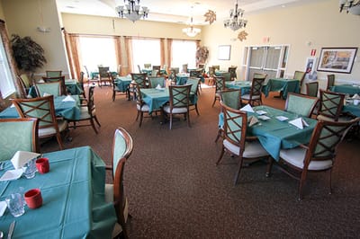 Dining room with tables set for meals