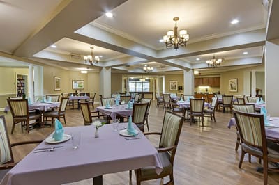 Bright dining room with elegantly set tables
