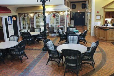 View of a common area with tables and chairs
